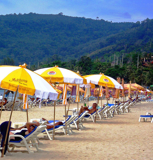 Yellow and white umbrellas on the beach