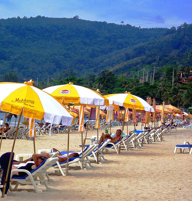 Yellow and white umbrellas on the beach Yellow and white umbrellas on the beach